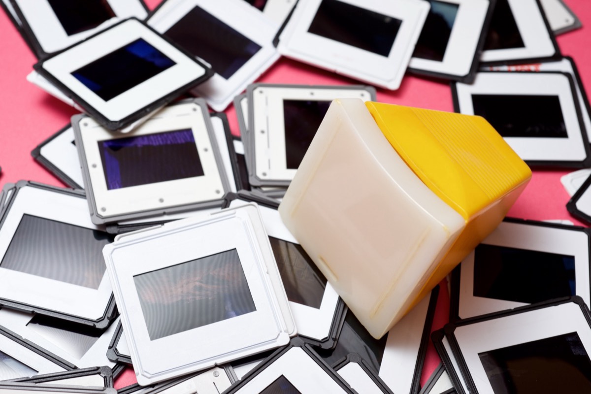Rows of photographic slides and contact sheets on a light table.