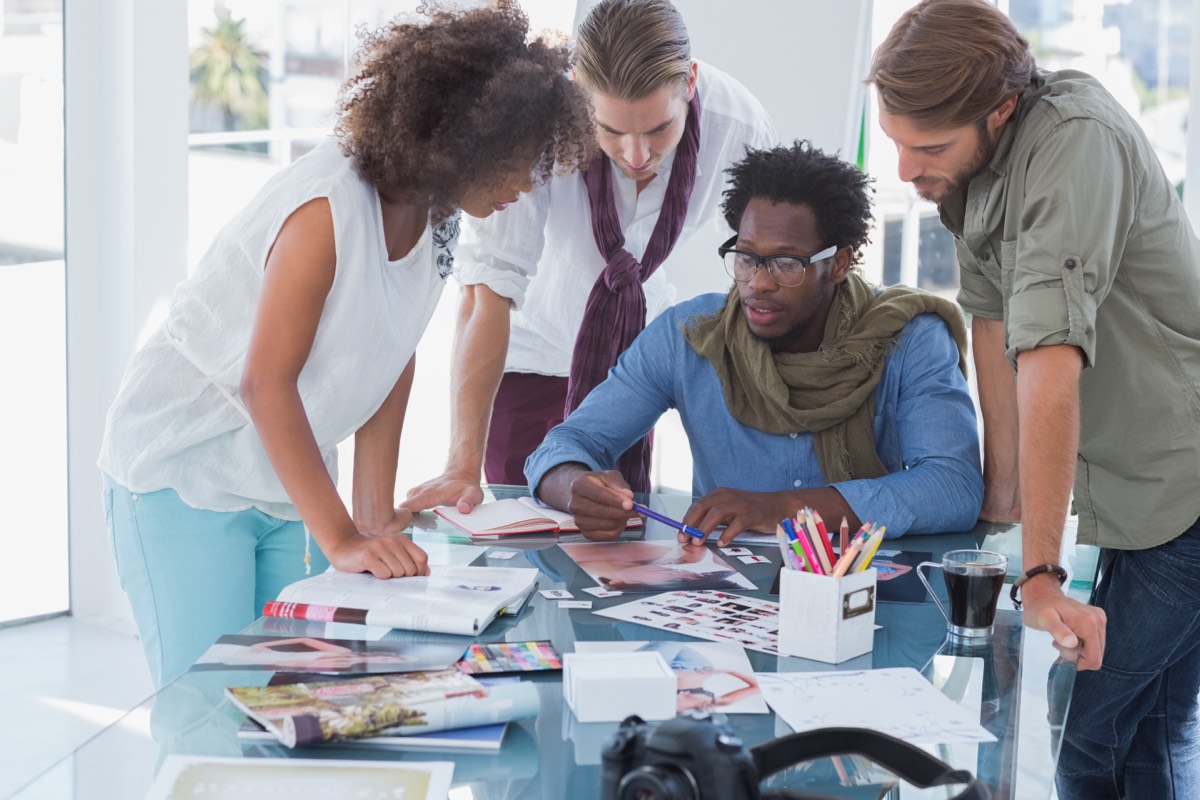 Screenwriter pitching a film idea to executives across a conference table