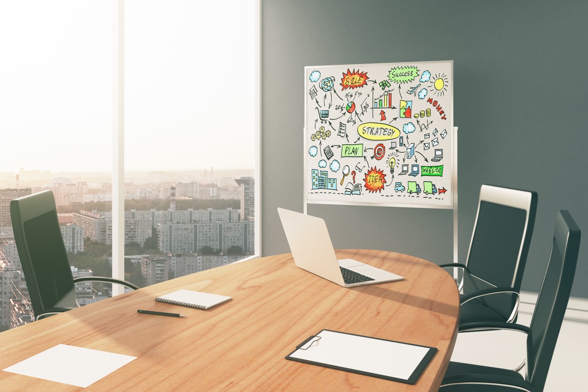 Investors reviewing a startup's documents around a boardroom table