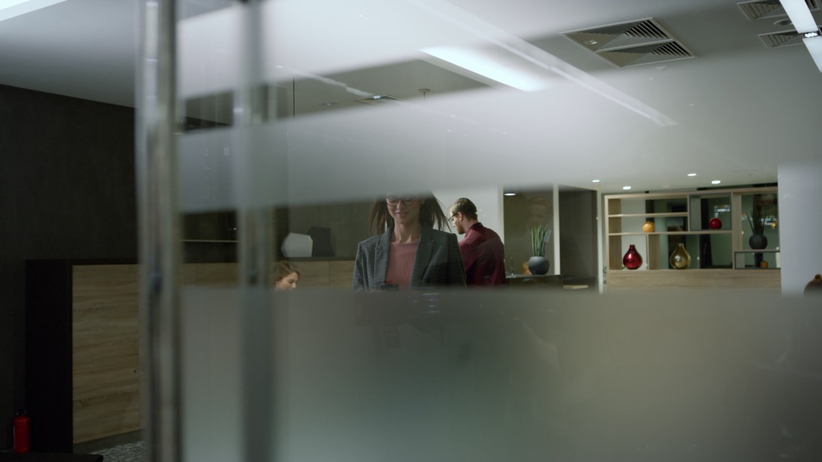 Two paths diverging with business documents on a desk
