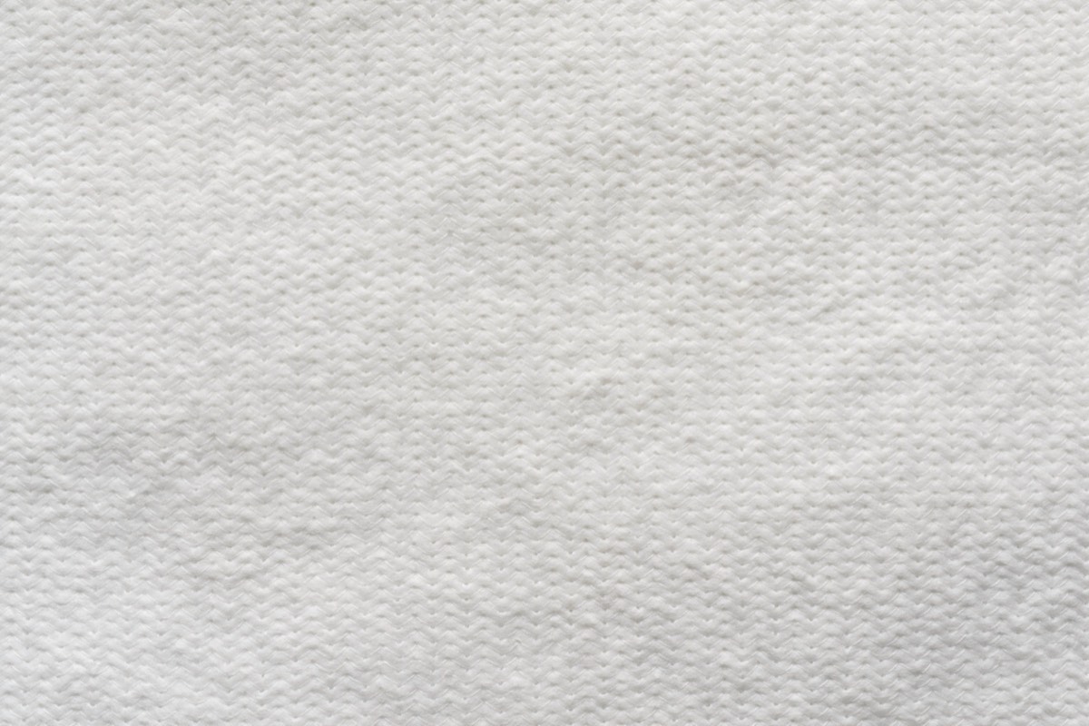 A magnified pattern of tiny dots printed on paper