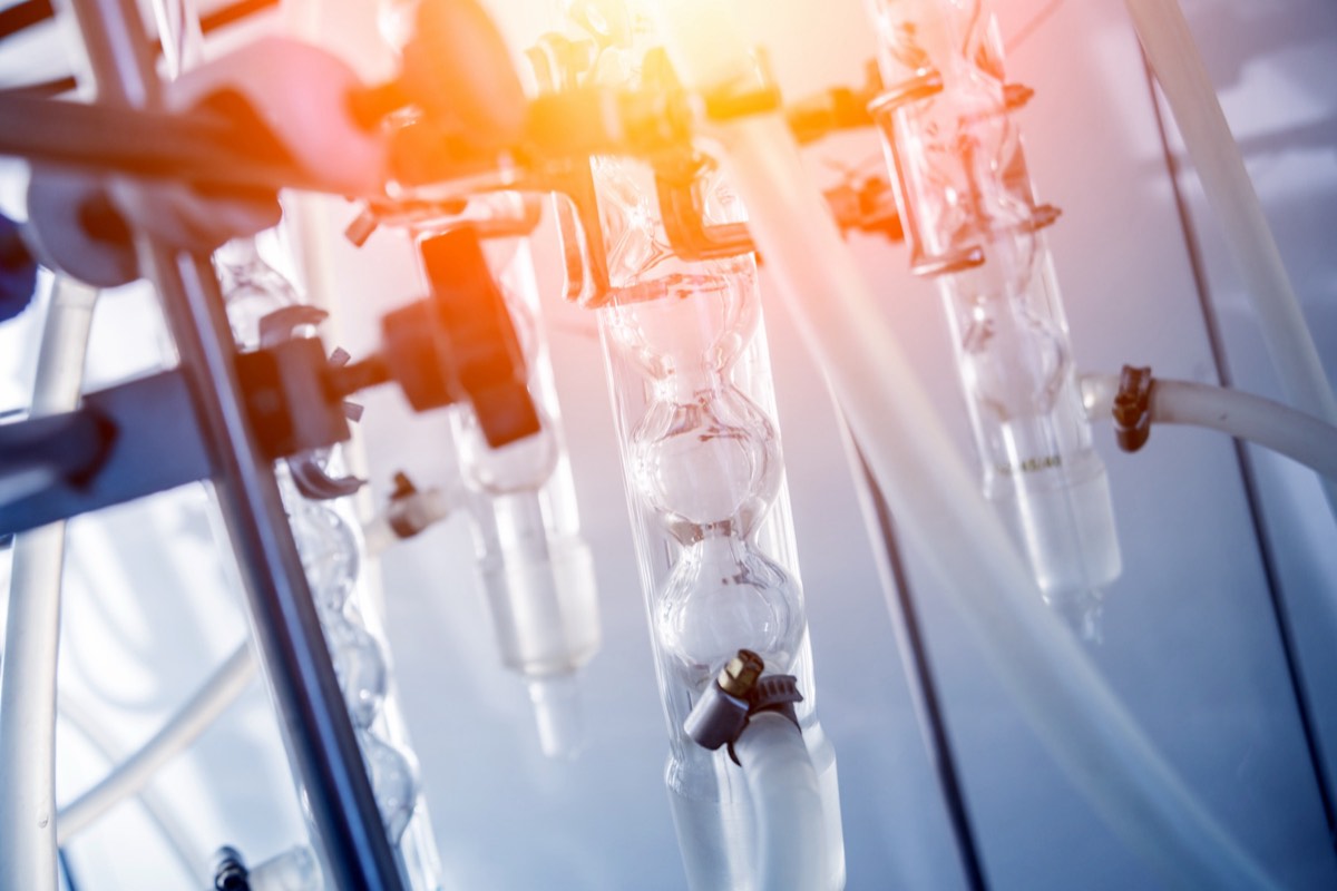 Glassware and reagents on a chemistry laboratory bench