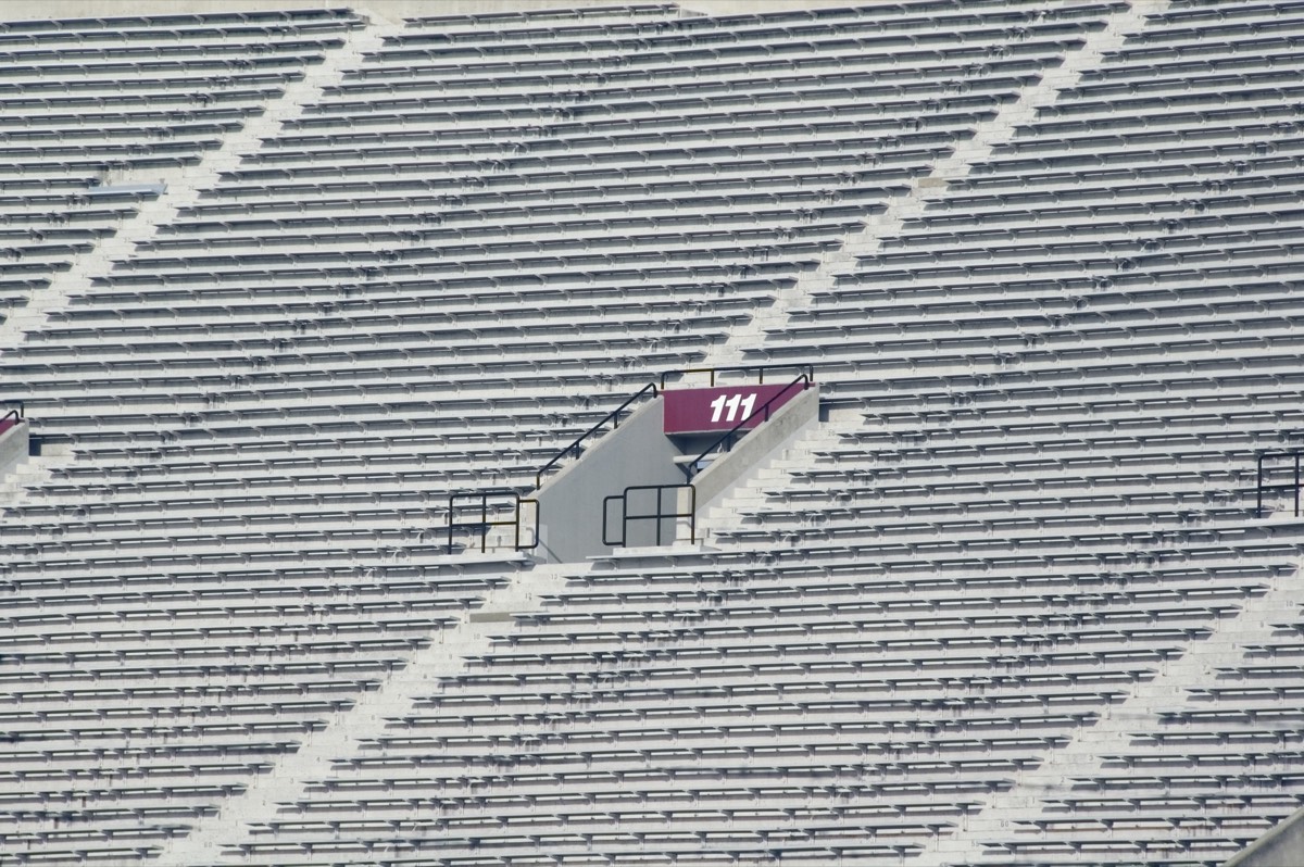 Empty college football stadium under a clear sky