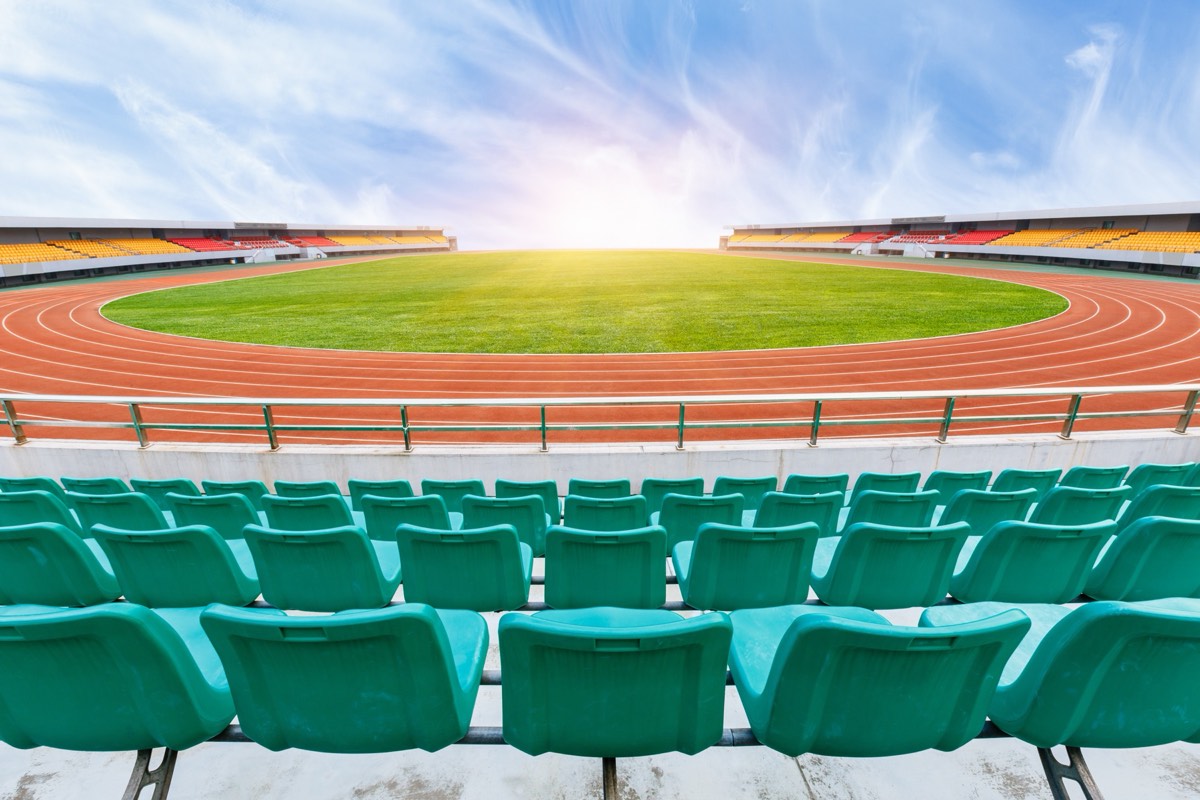 An empty college football stadium at dusk