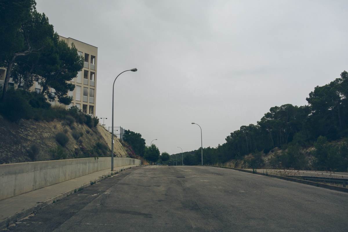 A vintage sedan parked on an empty street