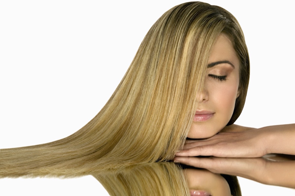 A model's promotional photograph on a retail hair-care package