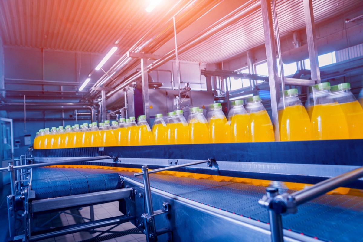 Stacked aluminum beverage cans on an industrial line
