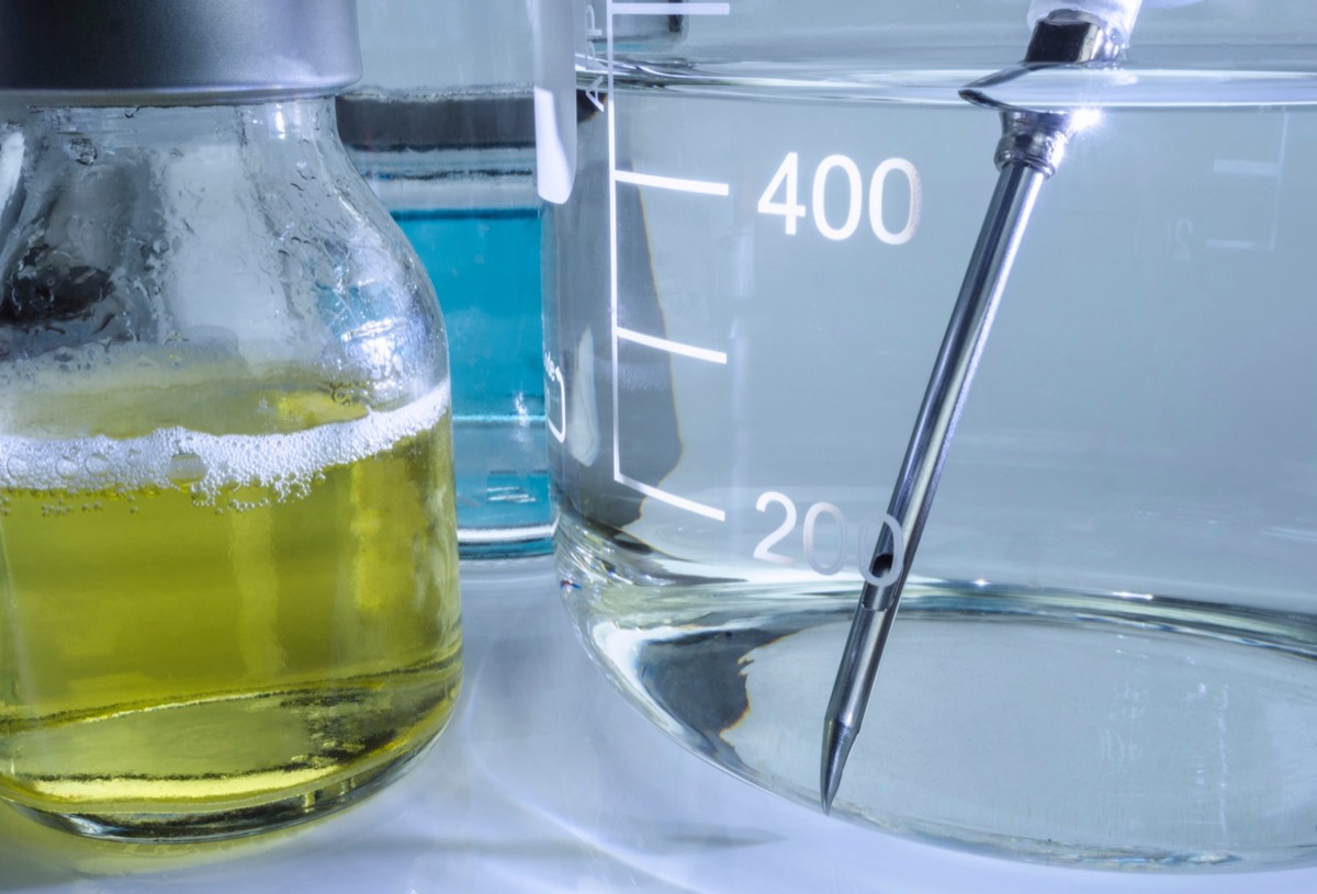 Scientist working with vials in a pharmaceutical research laboratory