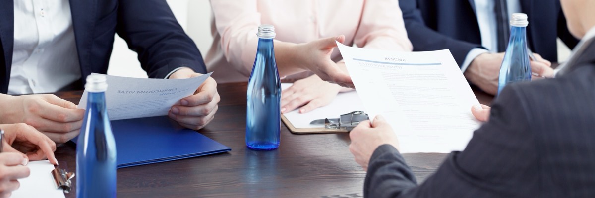 Two competing beverage bottles on a conference table