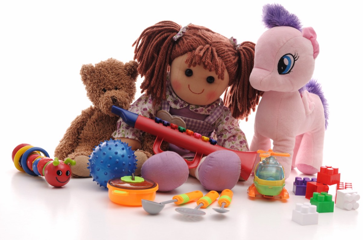 A plush dog chew toy shaped like a small handbag