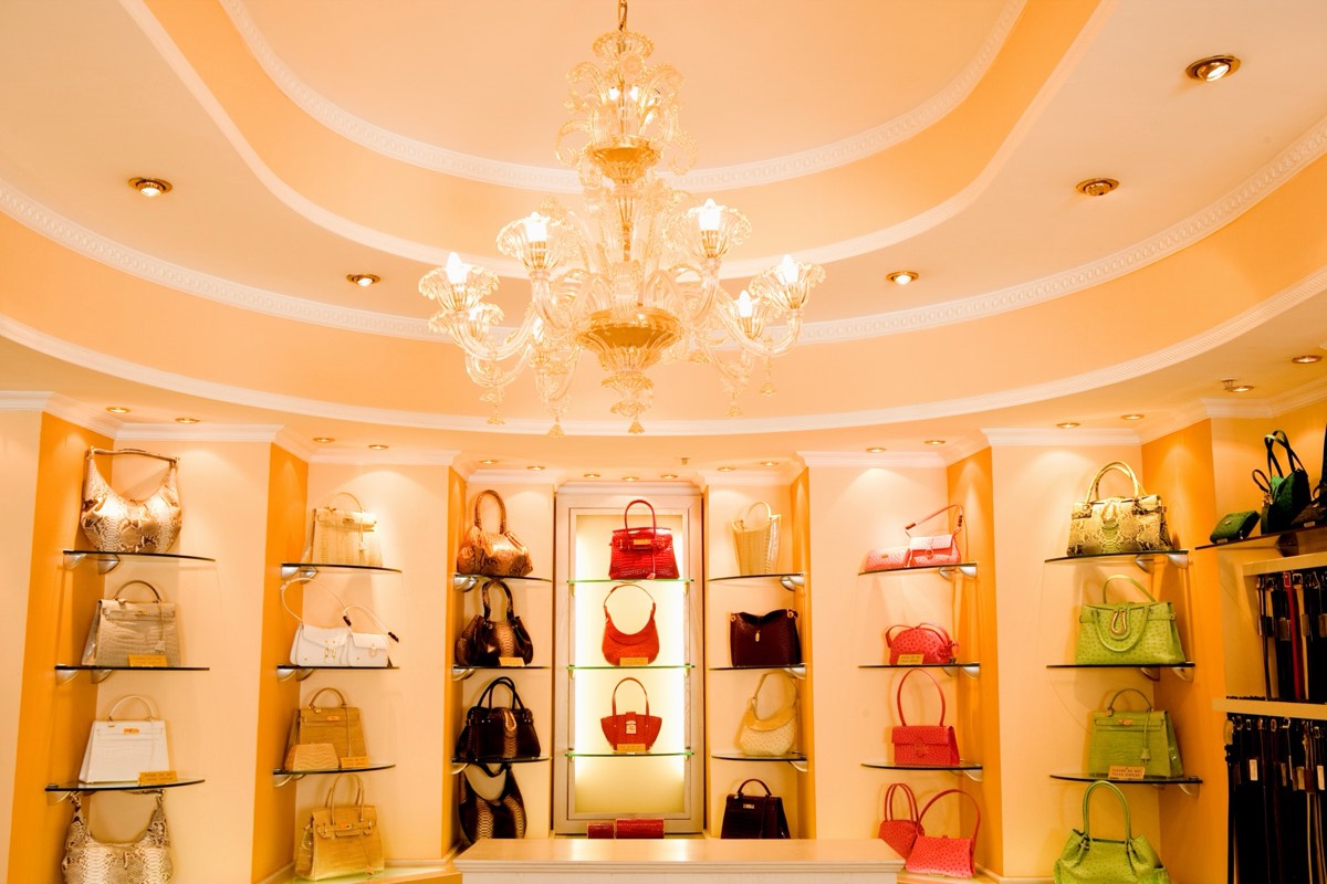 Leather handbags with metal fasteners on a retail display